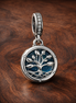 Glow-in-the-dark Infinity Tree Double Dangle Charm — display on walnut