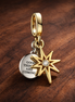 Gold Plated Comic Burst Charm - Comic Burst Charm — display on walnut