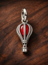 Hot Air Balloon Murano Glass Dangle Charm — display on walnut