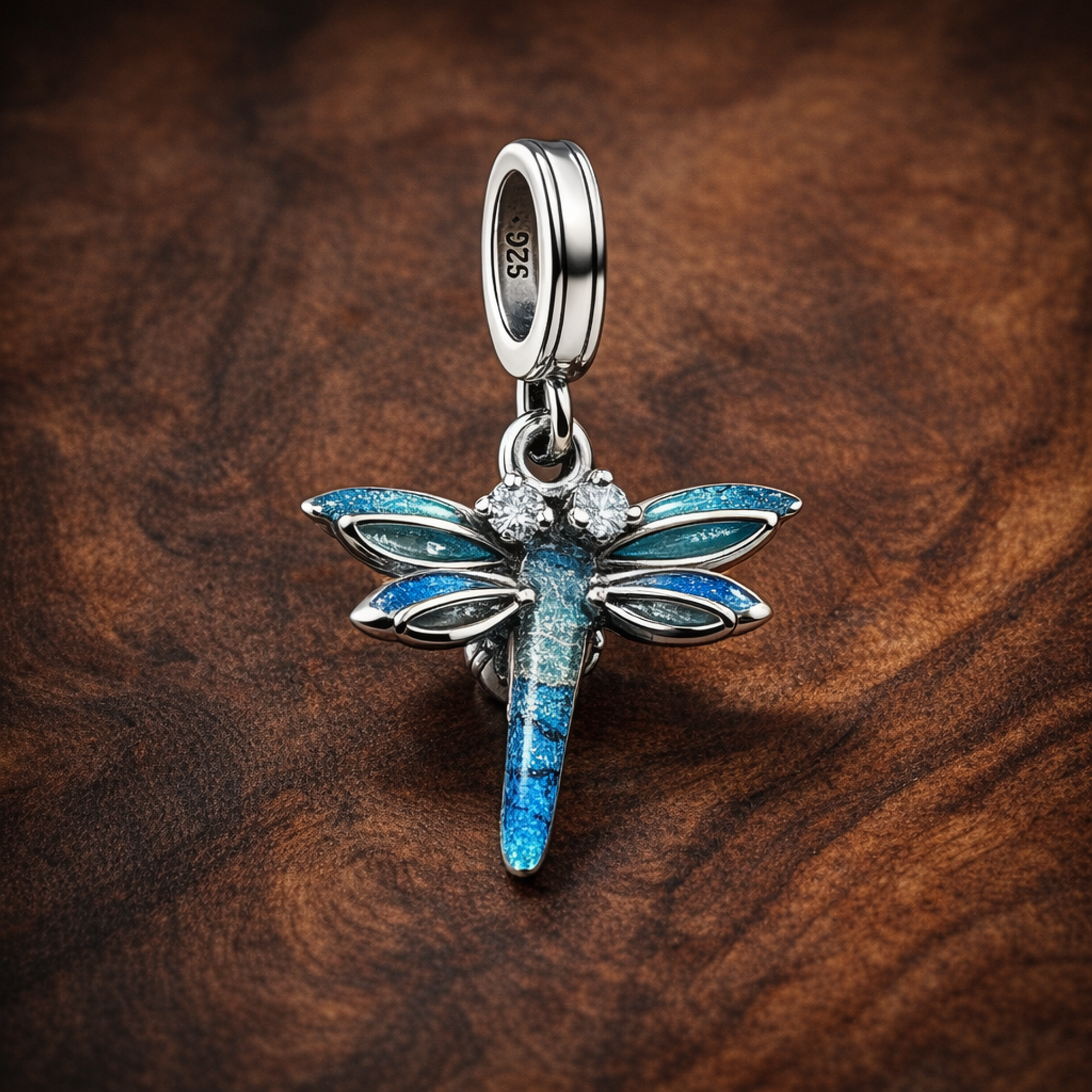 Dragonfly Double Dangle Charm — display on walnut