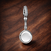 Silver Ring Dangle Charm - Silver Ring Dangle Charm — display on walnut
