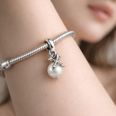 Pearl & Arrows Mini Dangle Charm — worn on wrist