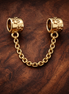 Gold Plated Chain Safety Charm - Gold Plated Chain Safety Charm — display on walnut