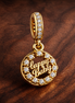 Gold Plated Shell Pearl Charm - Gold Plated Shell Pearl Charm — display on walnut