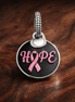 Hope Ribbon Dangle - Hope Ribbon Dangle Charm — display on walnut