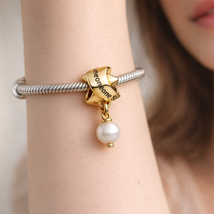 Treated Freshwater Cultured Pearl Ribbon Charm — worn on wrist