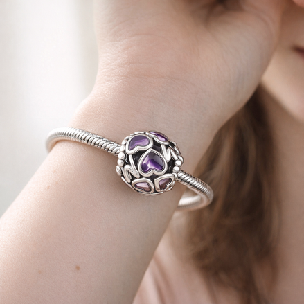 Openwork Hearts Mom Charm — worn on wrist