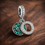 Green Double Circle Dangle - Green Double Circle Dangle Charm — display on walnut