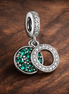 Green Double Circle Dangle - Green Double Circle Dangle Charm — display on walnut