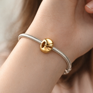 Round Clip Charm — worn on wrist