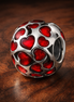 Red Heart Confetti Charm - Red Heart Confetti Charm — display on walnut