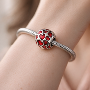 Red Heart Confetti Charm - Red Heart Confetti Charm — worn on wrist