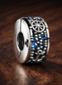 Blue Gear Star Bead - Blue Gear Star Bead Charm — display on walnut