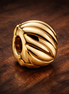 Gold Plated Ribbed Melon Charm - Gold Plated Ribbed Melon Charm — display on walnut