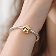 Gold Plated Ribbed Melon Charm - Gold Plated Ribbed Melon Charm — worn on wrist