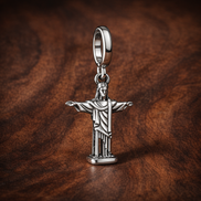 Christ the Redeemer Charm - Christ the Redeemer Charm — display on walnut