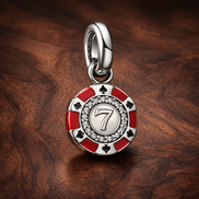 Lucky Chip Dangle Charm — display on walnut