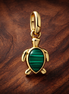 Green Turtle Charm - Green Turtle Charm — display on walnut