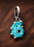 Turquoise Flower Charm - Turquoise Flower Charm — display on walnut