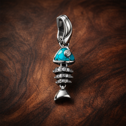 Fishbone Turquoise Charm - Fishbone Turquoise Charm — display on walnut