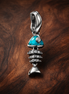 Fishbone Turquoise Charm - Fishbone Turquoise Charm — display on walnut