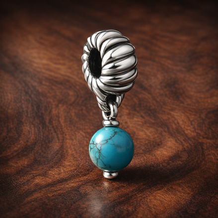 Turquoise-colored Dangle Charm — display on walnut