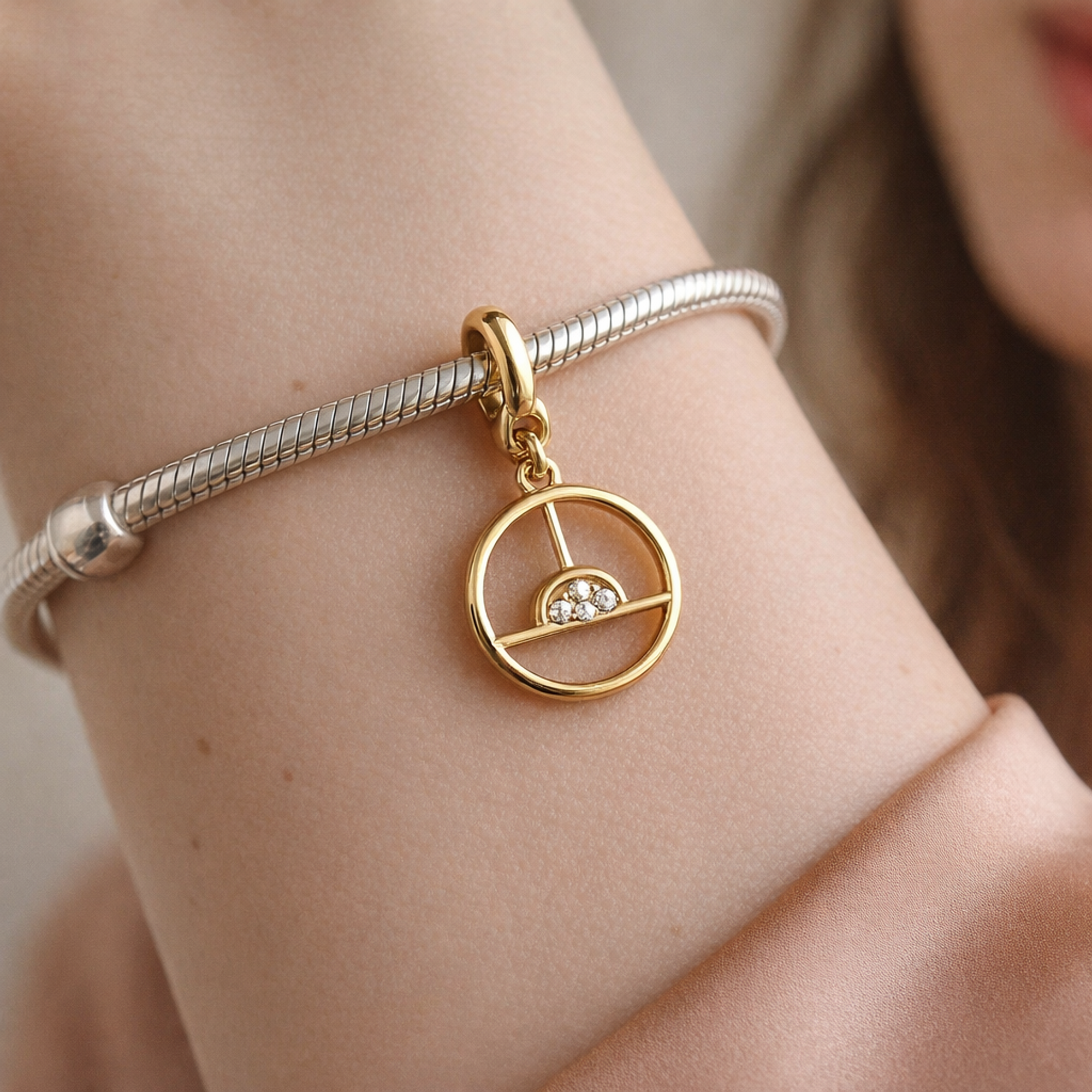 Sunrise Medallion Charm — worn on wrist