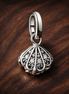 Sparkling Shell Mini Dangle Charm — display on walnut