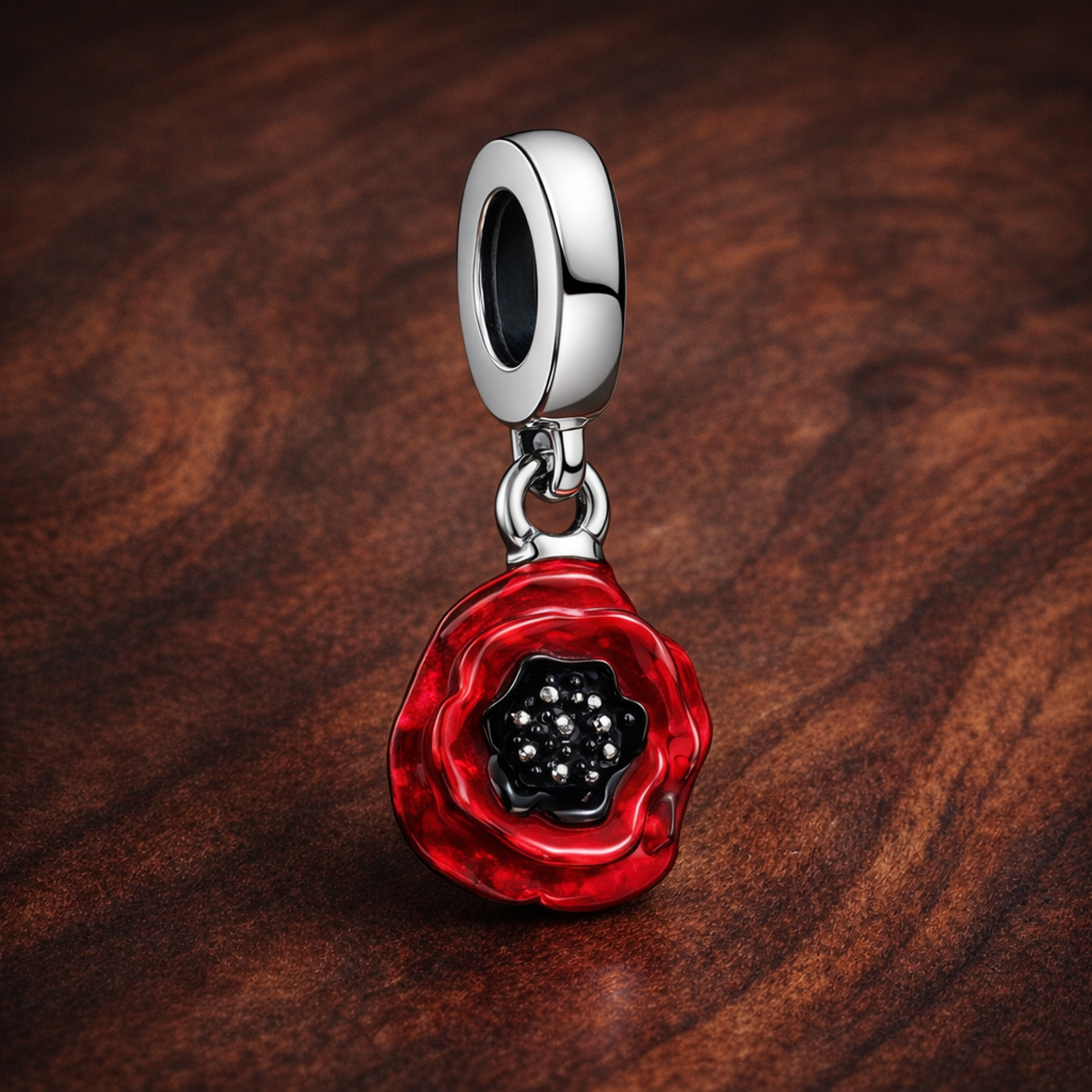 Red Flower Dangle Charm — display on walnut