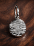 Engravable Mini Medallion Charm — display on walnut