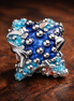 Colorful Starfish Mini Charm — display on walnut