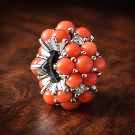 Coral-colored Ocean Charm — display on walnut