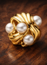 Gold Plated Shell Pearl Cluster Charm - Shell Pearl Cluster Charm — display on walnut
