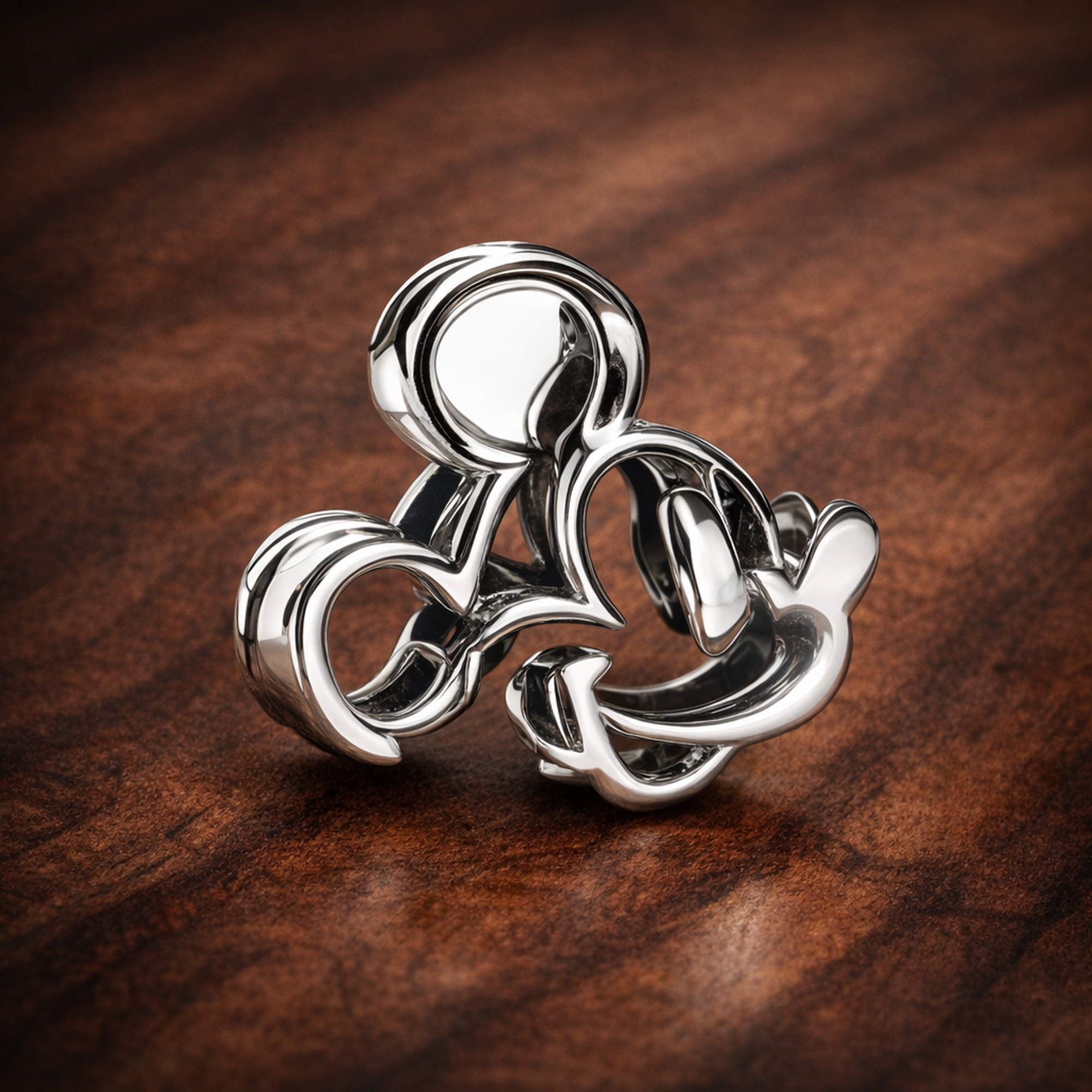 Disney Mickey Mouse Openwork Charm — display on walnut