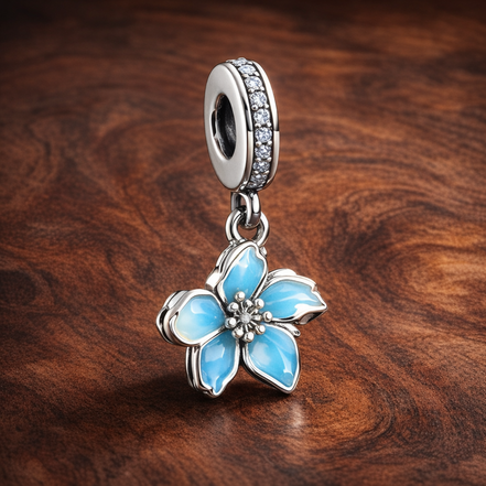 Blue Blossom Dangle Charm — display on walnut
