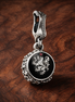 Yin Yang Star Medallion - Yin Yang Star Medallion Charm — display on walnut