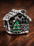 Gingerbread House Bead - Gingerbread House Bead Charm — display on walnut
