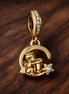 Gold Plated Moon Fu Dangle - Gold Plated Moon Fu Dangle Charm — display on walnut