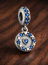 Blue Heart Dangle - Blue Heart Dangle Charm — display on walnut
