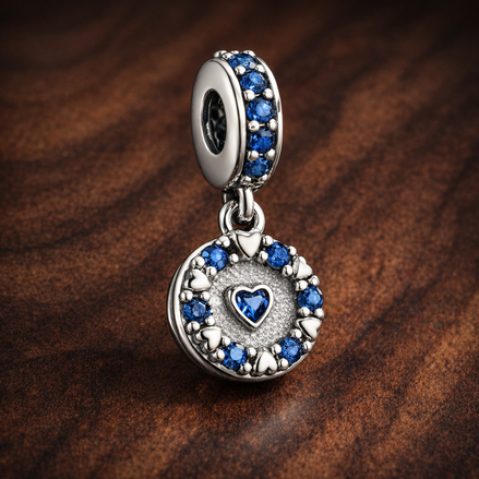 Blue Heart Dangle - Blue Heart Dangle Charm — display on walnut