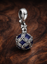 Purple Knot Medallion - Purple Knot Medallion Charm — display on walnut
