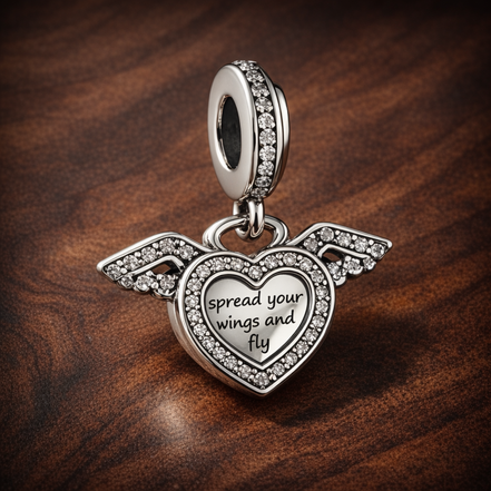 Heart and Angel Wings Dangle Charm — display on walnut