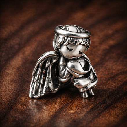 Angel of Love Charm — display on walnut