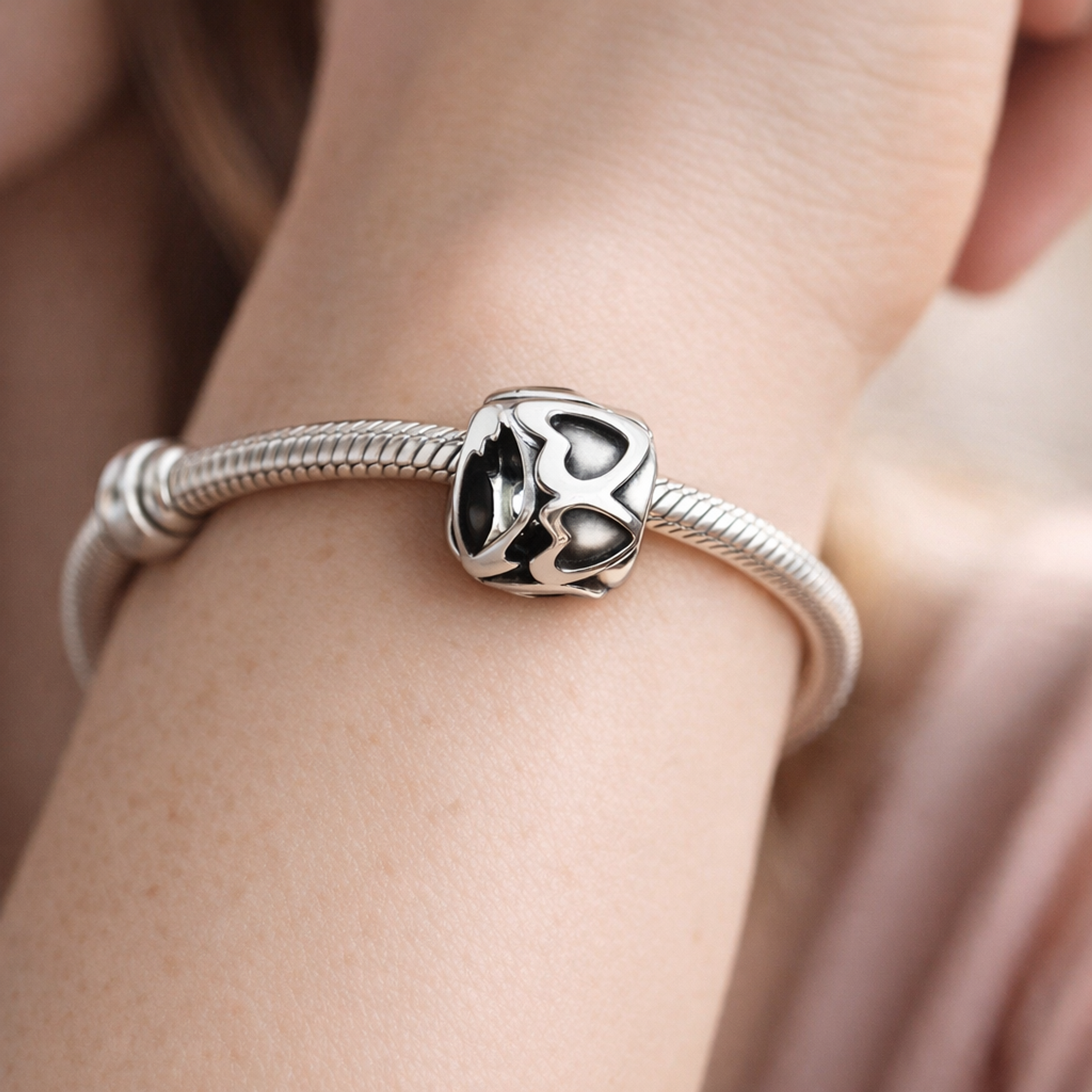 Band of Hearts Clip Charm — worn on wrist