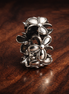 Silver Character Cluster - Tiny Friends Silver Charm — display on walnut
