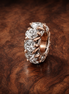 Sparkling Row Spacer Charm — display on walnut