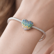 Rainbow Pave Heart - Rainbow Crystal Heart Charm — worn on wrist