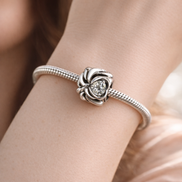 Swirl Pattern Spacer Heart Stone - Sterling Silver Swirl Pattern Spacer Charm With Heart Stone — worn on wrist