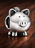 Silver Piggy Bank - Polished Piggy Bank Charm — display on walnut