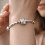 Sparkling Pavé Lines & Logo Clip Charm — worn on wrist